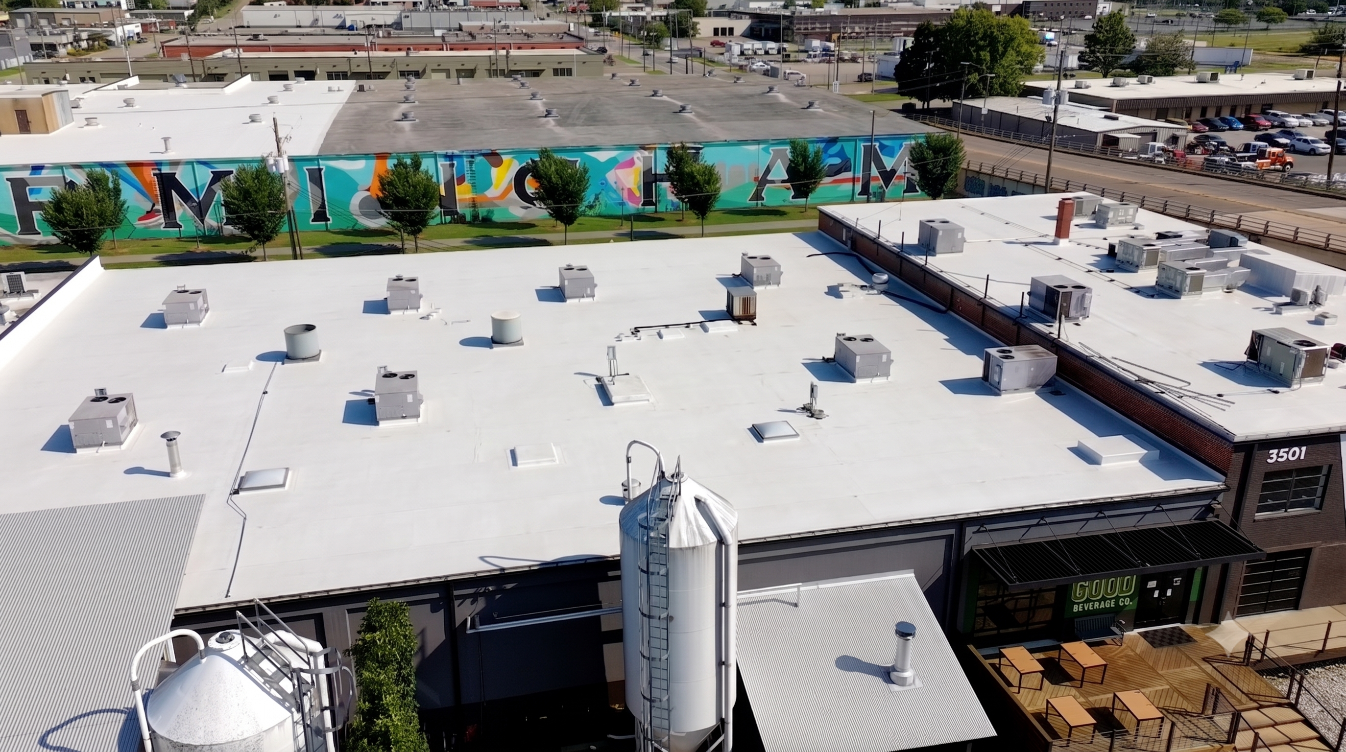 White flat membrane roof with rooftop HVAC on All Good Beverage Co, Birmingham AL