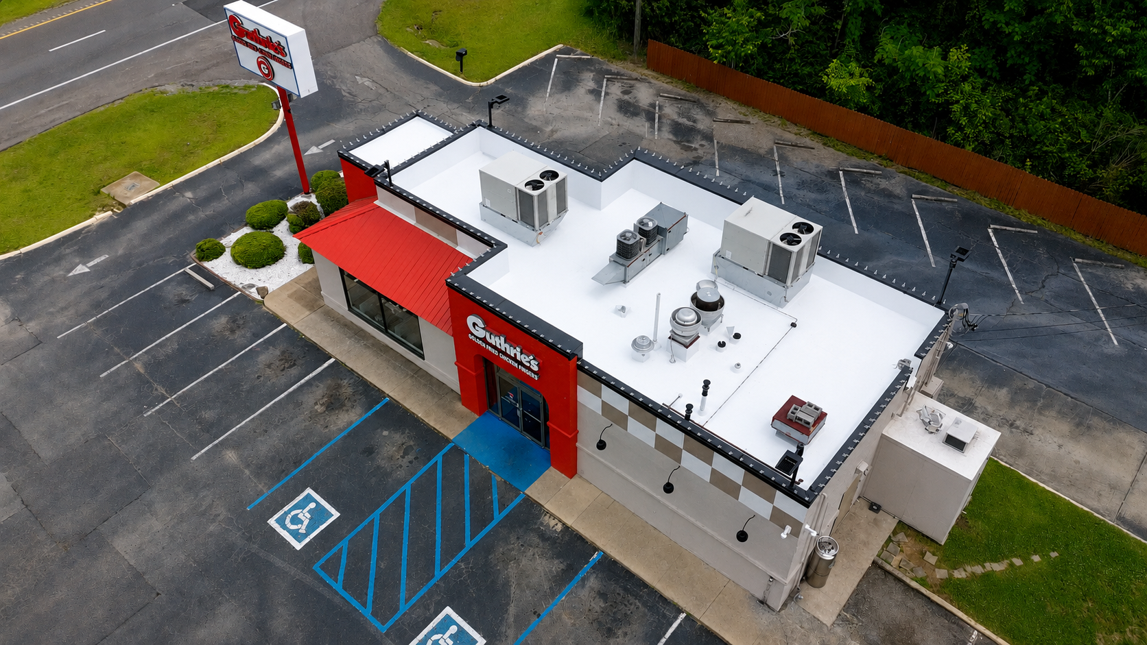White flat membrane roof with rooftop HVAC units on a Guthrie's restaurant, Dora AL