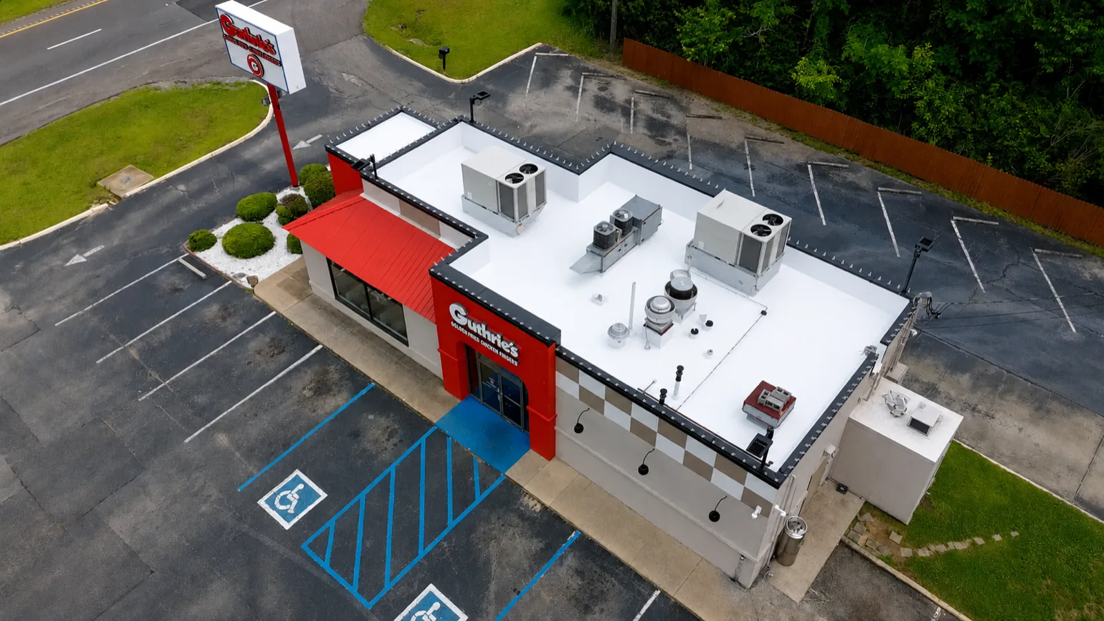 White flat membrane roof with rooftop HVAC units on a Guthrie's restaurant, Birmingham metro