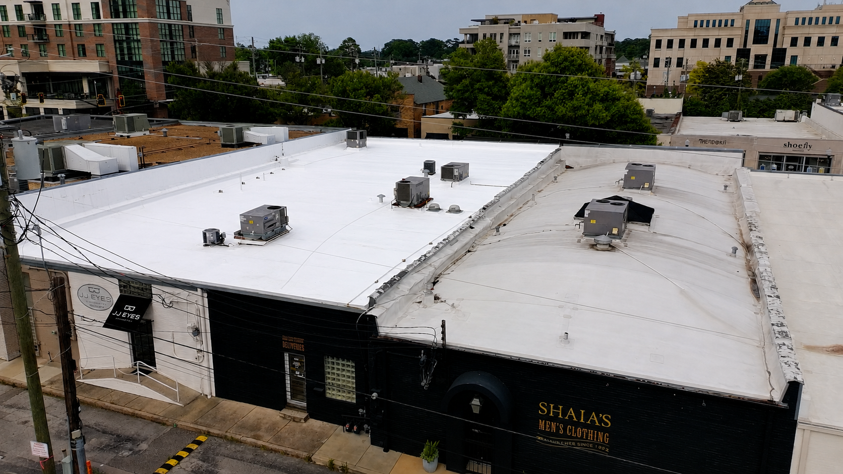 White TPO membrane roof with rooftop HVAC on the Shaia's building, Homewood AL